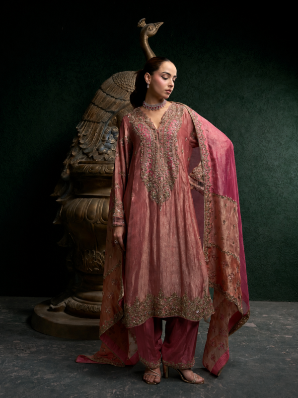 Royal rose gold metallic tissue suit with heavy embroidery paired with a matching tulip salwar.