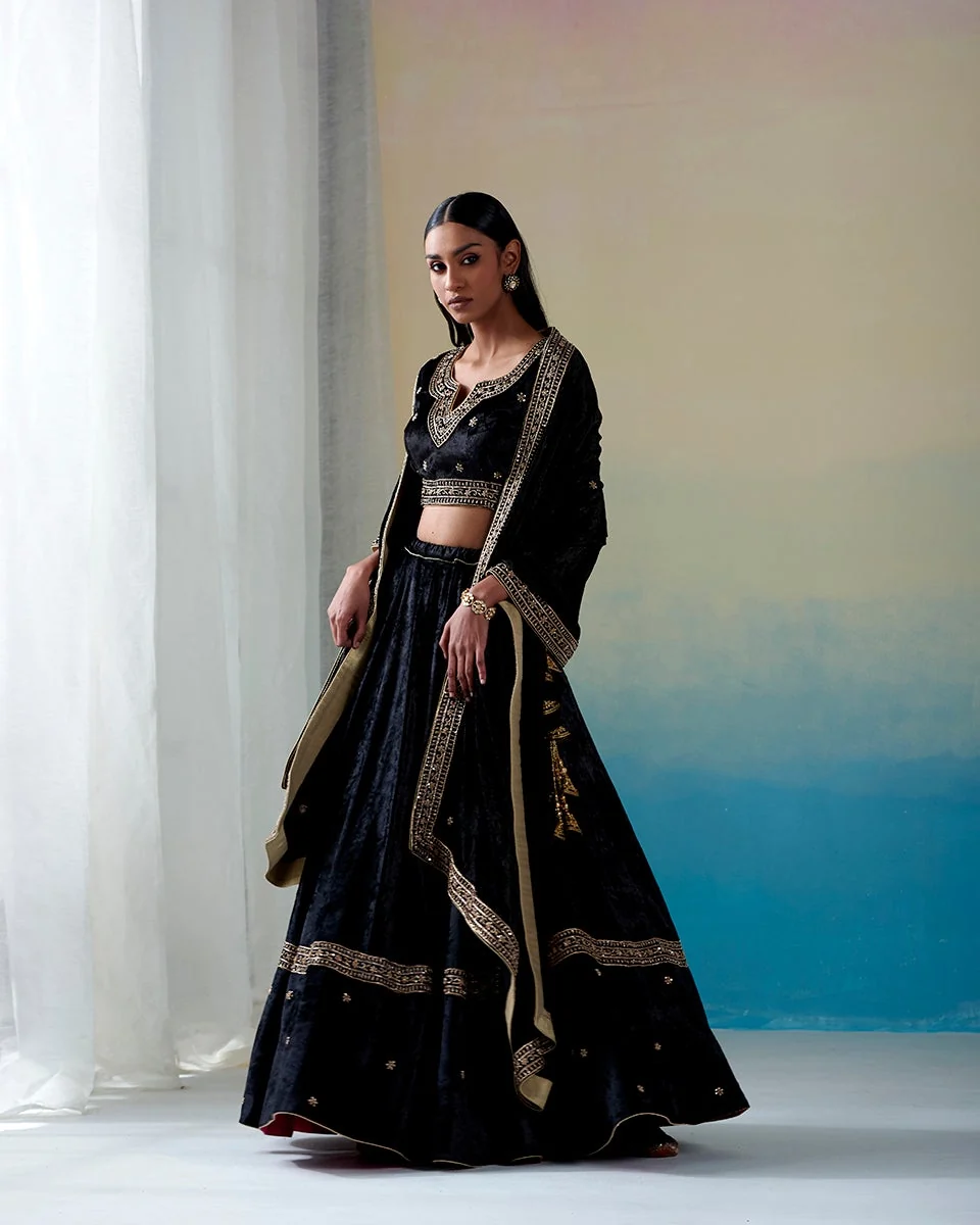 Black hand-embroidered zardozi velvet kalidaar lehenga set with blouse and doshala by CoutureCraze