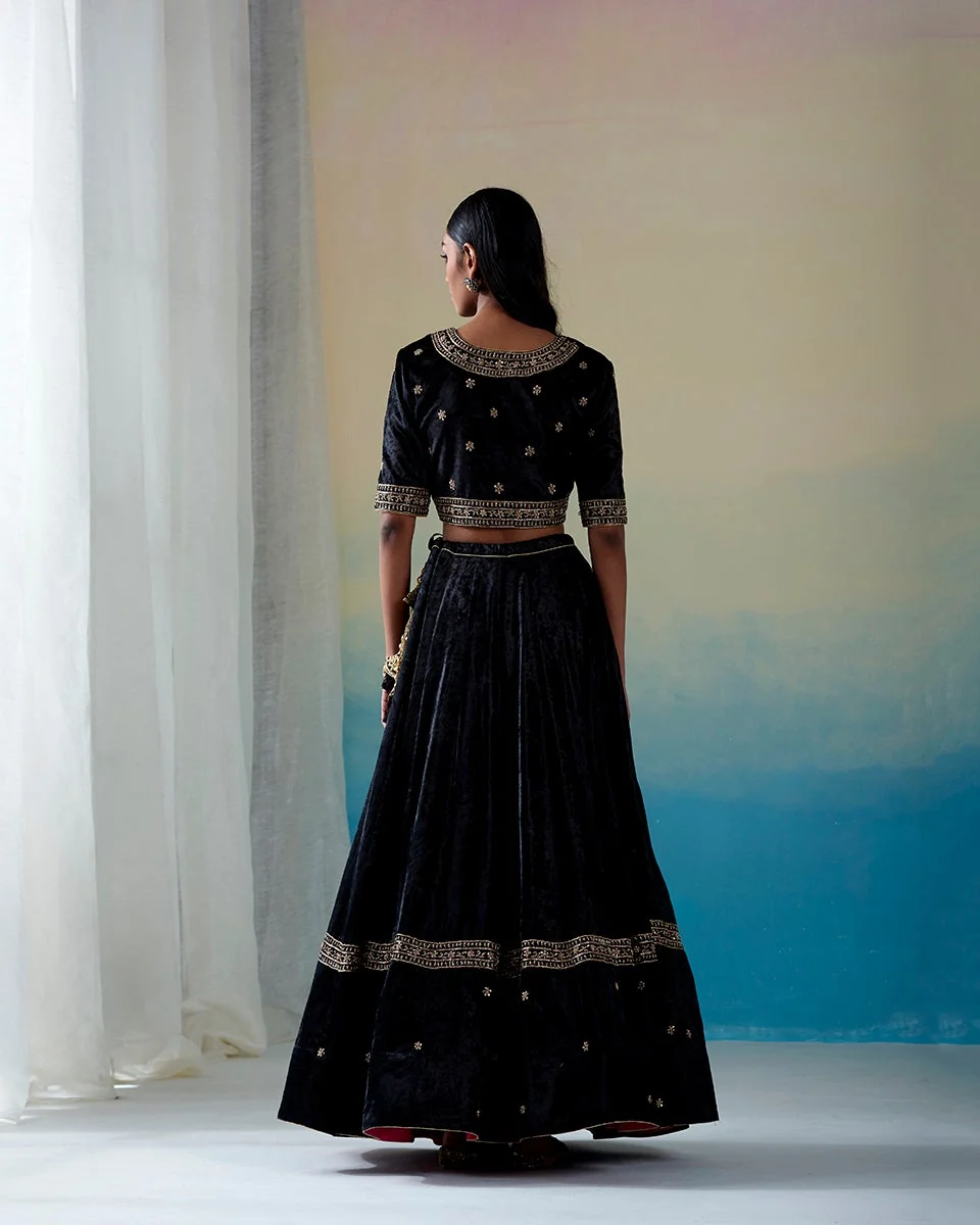Black hand-embroidered zardozi velvet kalidaar lehenga set with blouse and doshala by CoutureCraze
